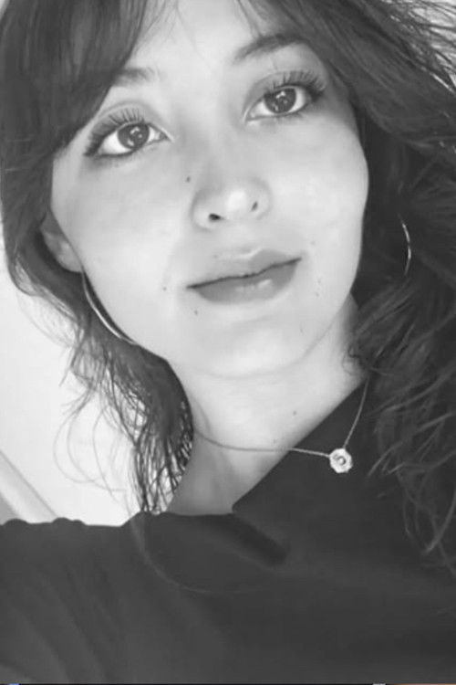 Anna Cortado as Laura (New Student)