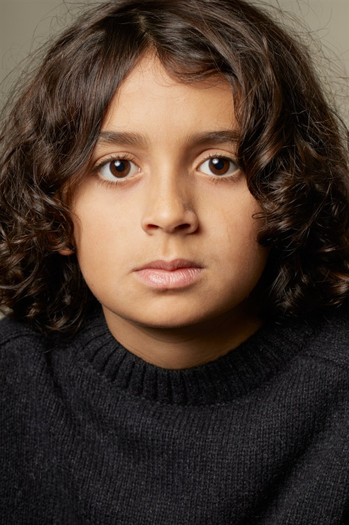 Naïm Naji as Roland Perez (5-7 years old)