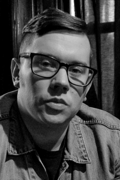 Jason Zink as Protest Leader's Assistant