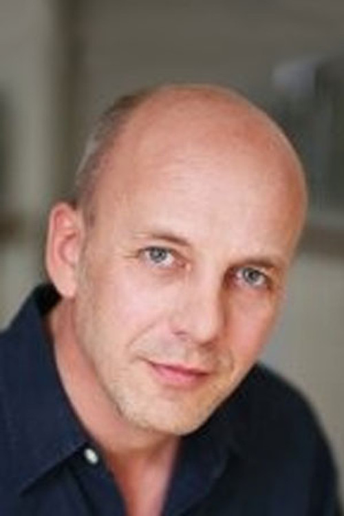 Simon Pearsall as Travel Agent