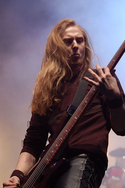 Krzysztof „Bacchus” Kłosek as Self - Bass