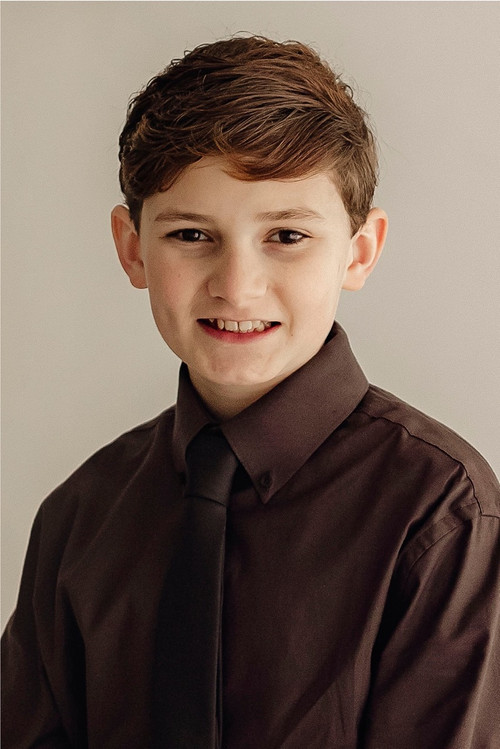 Isaac Lee as Crowd of Onlookers (Boy With Basketball)