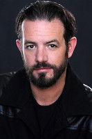 Mick Hodder as Carl Powers