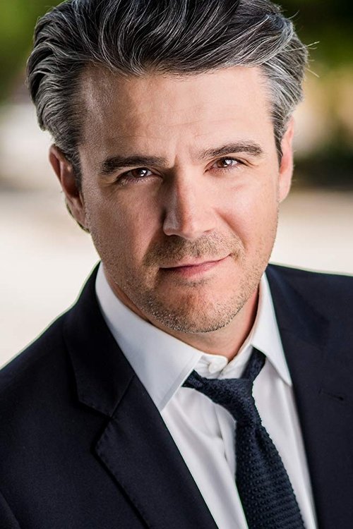 John Rushing as News anchorperson