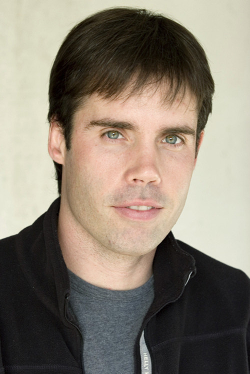 Keith Adams as Armored Truck Driver