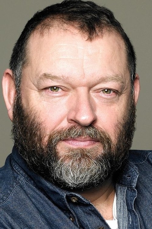 Dean Paul Gibson as Minister Weaver