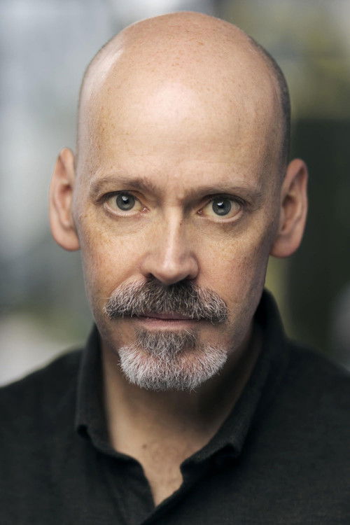 Daniel Olson as Train Passenger