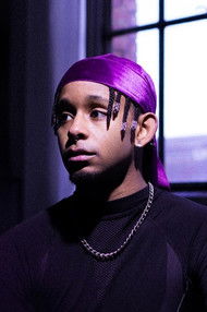 Robin Mateus as DJ Megalon