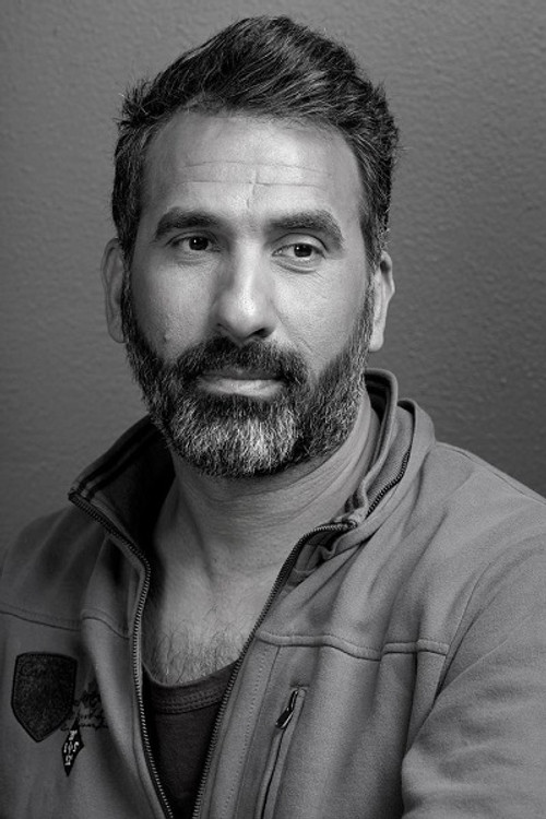 Aqil Dahhan as Ahmed Al Kadi