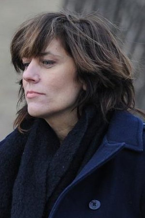 Tracy Wright as The Archivist