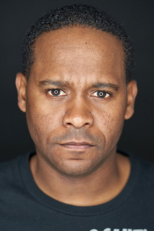 Norm Johnson as Inmate Librarian Ade Akionla