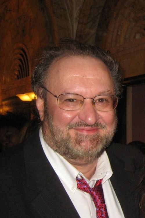 John A. Gallagher as The Director