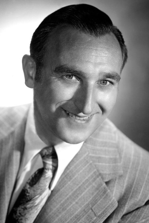 John Brown as Passport Photographer (uncredited)