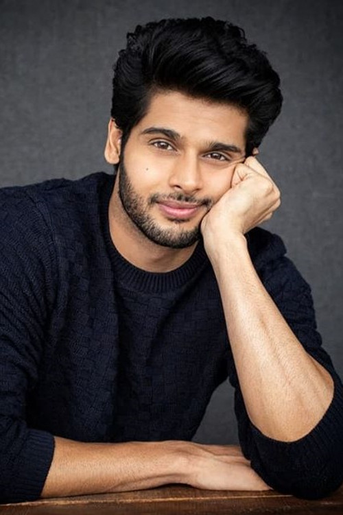 Abhimanyu Dasani as Guy watching news