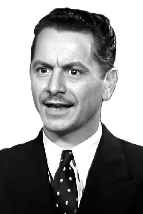 Roger Moore as Beauty Contest Spectator