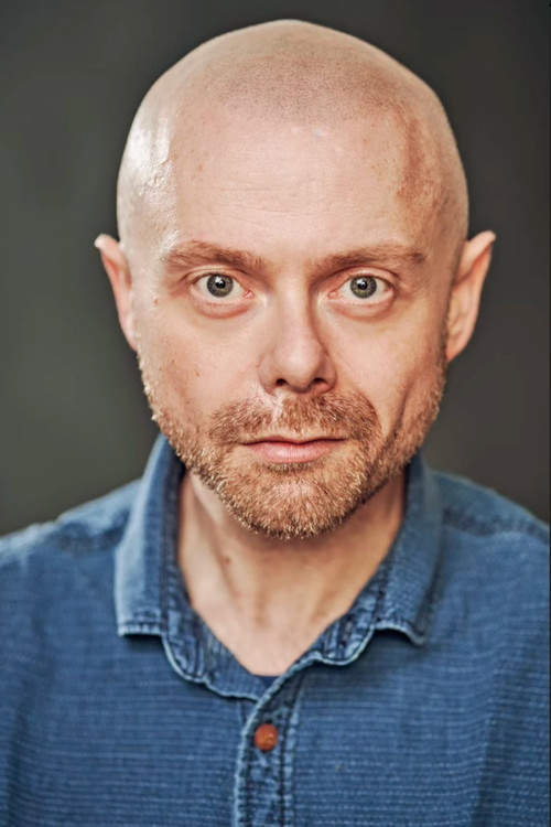 Liam Edwards as Voice Actor 1