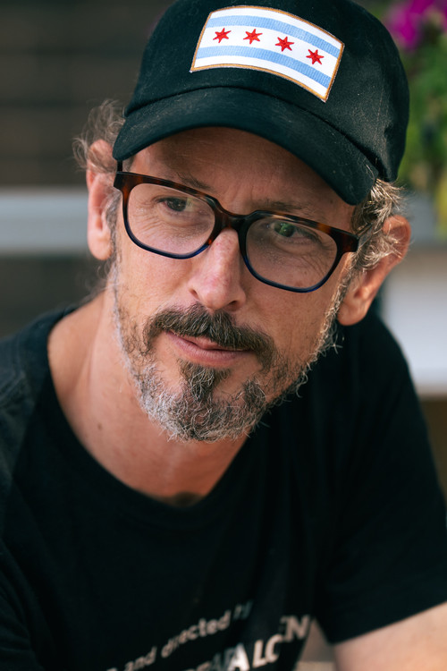 Michael Glover Smith as Man in Bathrobe