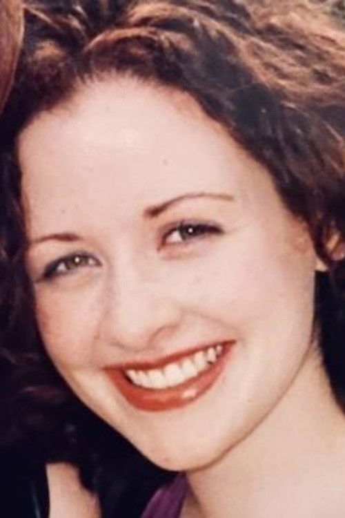 Kelly Mealia as Woman at Elaine's