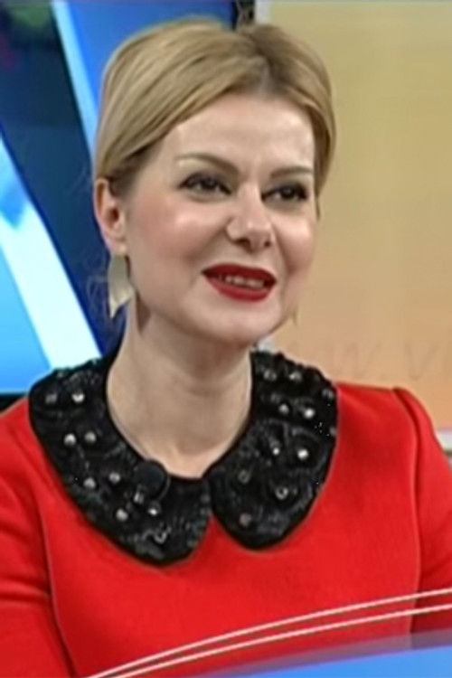 Manjola Begolli as Rudina