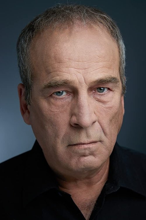 Tracy Miller as Secretary of Defense Denton