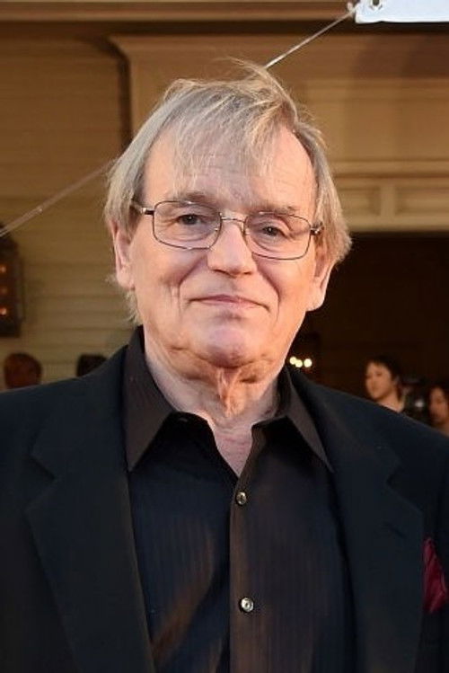 Norbert Meisel as Photographer Mike Lang