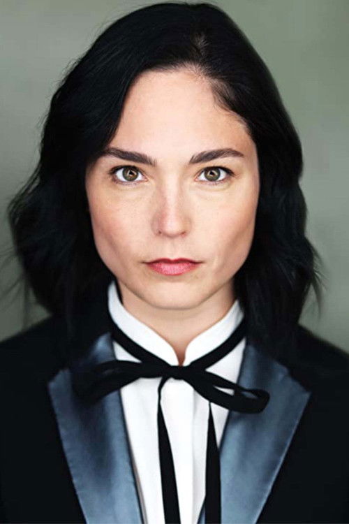 Caitlin Riley as R.K.