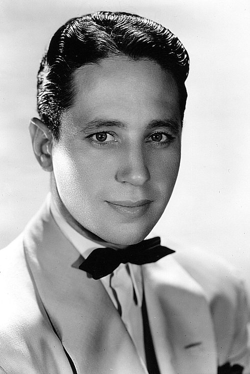 Ross Alexander as Tom Collins