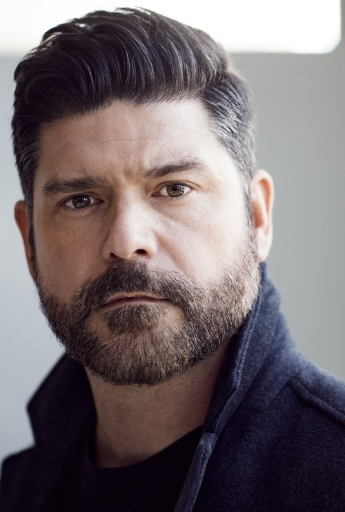 John T. Woods as Mark - Career Counselor