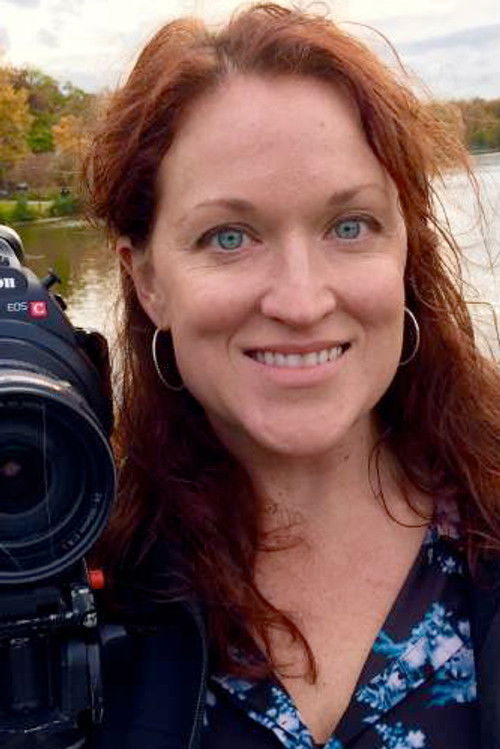 Emily Adams as Female Newscaster