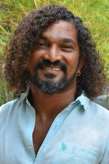 Stunt Silva as Minister Devaraj's Brother-in-Law