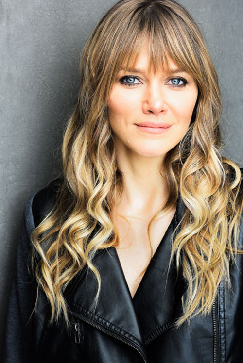 Brenda Schmid as Tracy Johnston