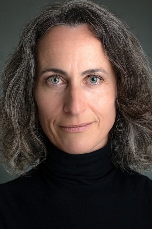 Laura Frances-Martin as Dr. Michaels (archive footage)