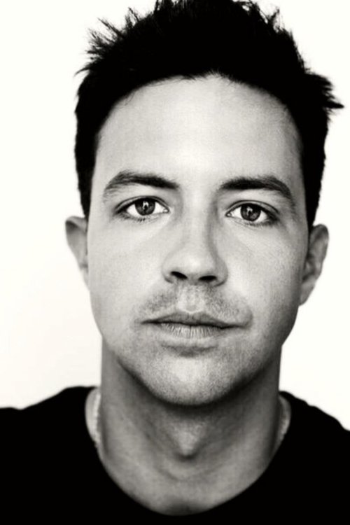 Will Hirschfeld as The Handler