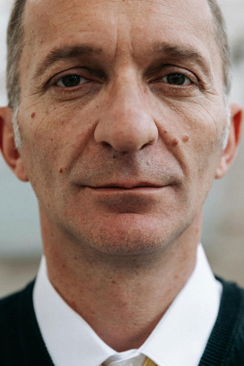 Ernest Malazogu as Hasani