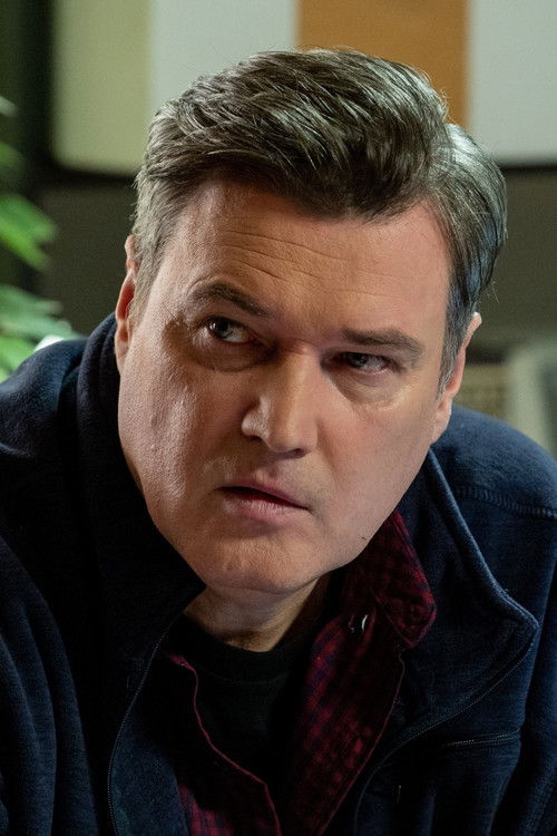 Artur Łodyga as commissioner Maksymilian