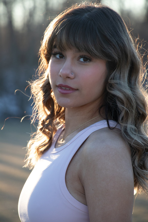 Sophia Harvey as Maya