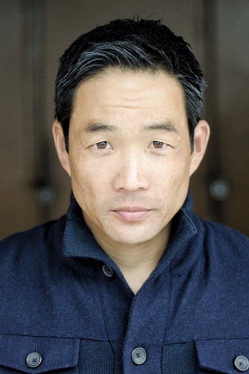 Chase Kim as Police Officer