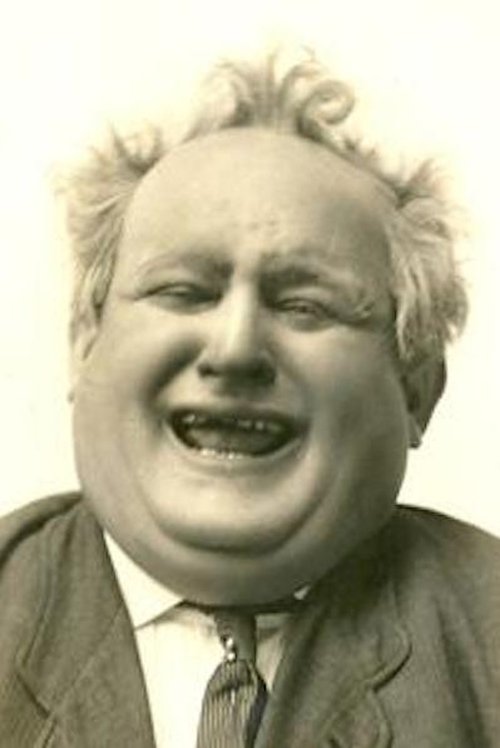 Jess Dandy as Garlico the Strong Man / Man in Audience (uncredited)