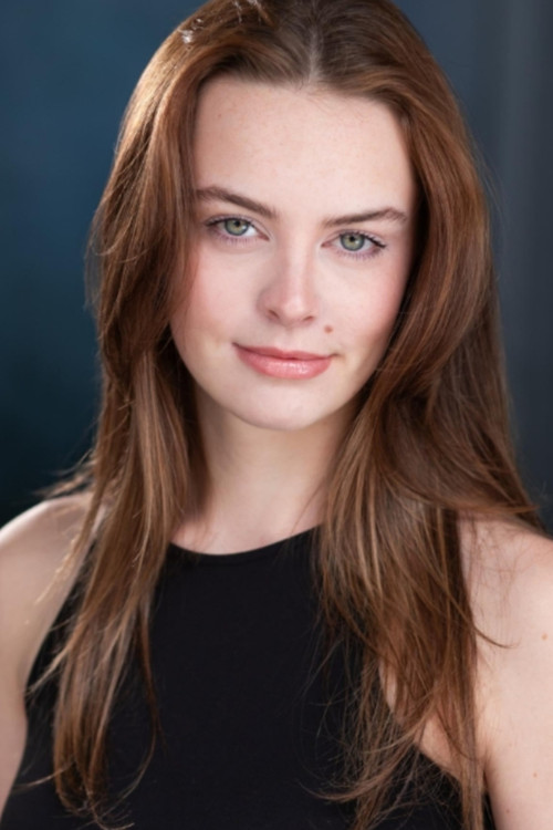 Courtney Baucom as Blue Alien Wife