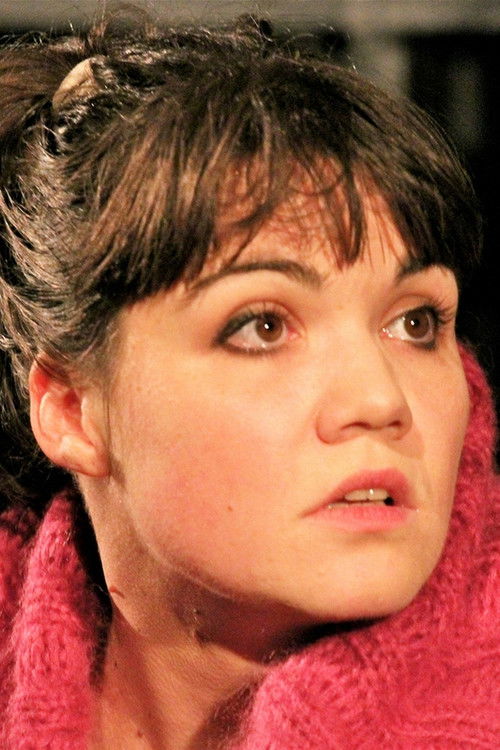 Rita Alexics as Buksi, the prompter