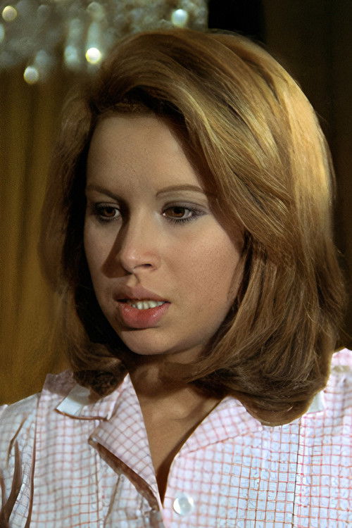 Marta Avilés as Prisoner in black dress