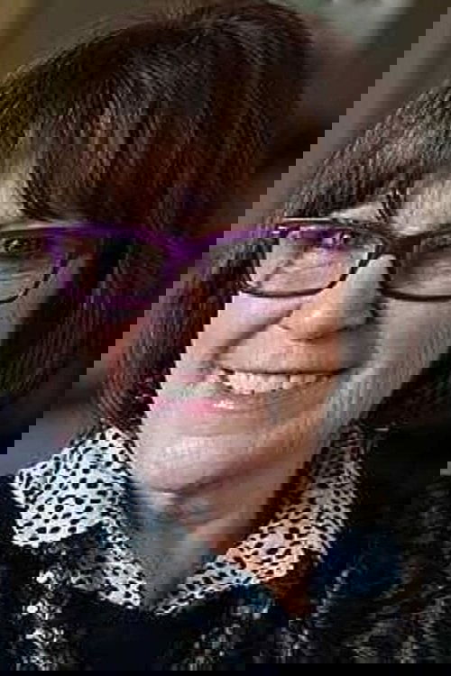 Marie Jones as Sarah