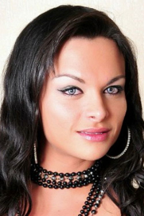 Natasha Rusthy as (archive footage)