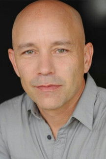 Guy Fauchon as Travel Agent Dan