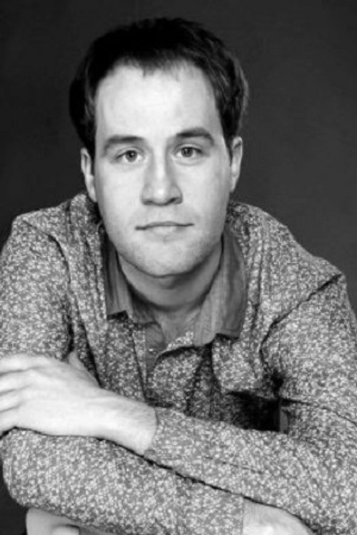 Oleksandr Valiuk as Warden 1