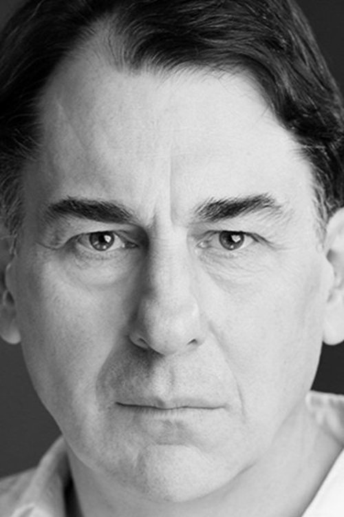 Simon Coury as Hugh Tomlinson