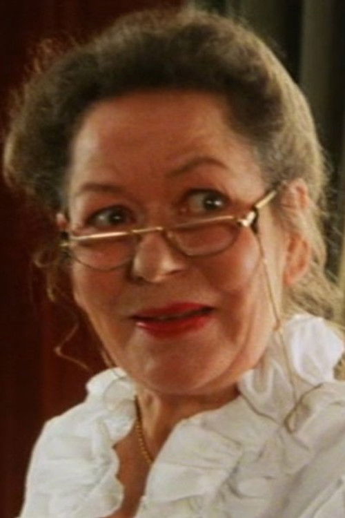 Hanne Løye as Daninvest Manager's Secretary