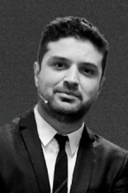 Miguel Maldonado as The Organizer