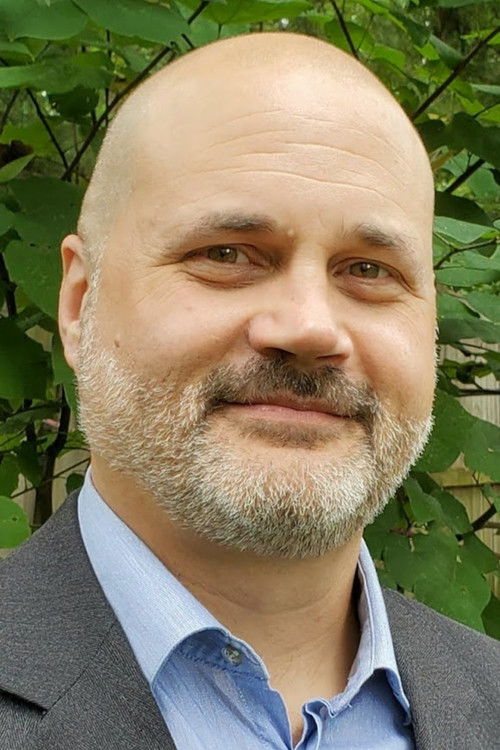 Trevor M. Przyuski as God