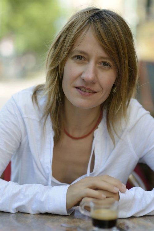 Jennipher Antoni as Mrs. Roland, Cashier